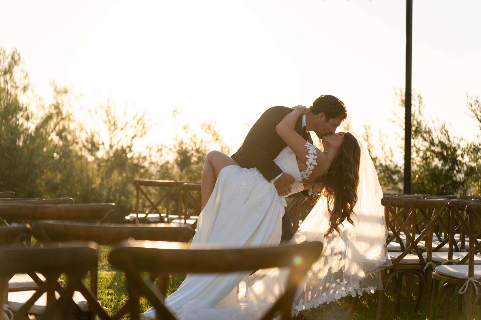 woman in white dress shirt kissing mans cheek